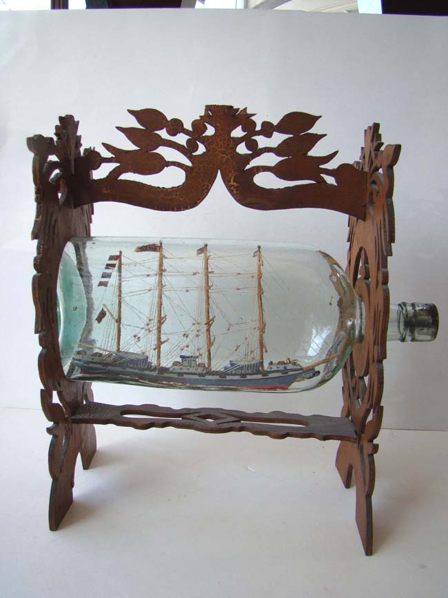 A fine 19th century Ship in a Bottle mounted in a carved fretwork stand circa 1880-1900 — image 2